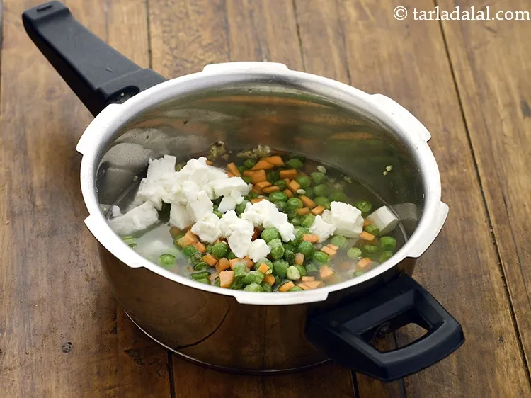 Step 14 – Mix well and pressure cook <strong>instant veg daila pulao recipe | bulgur wheat and paneer …