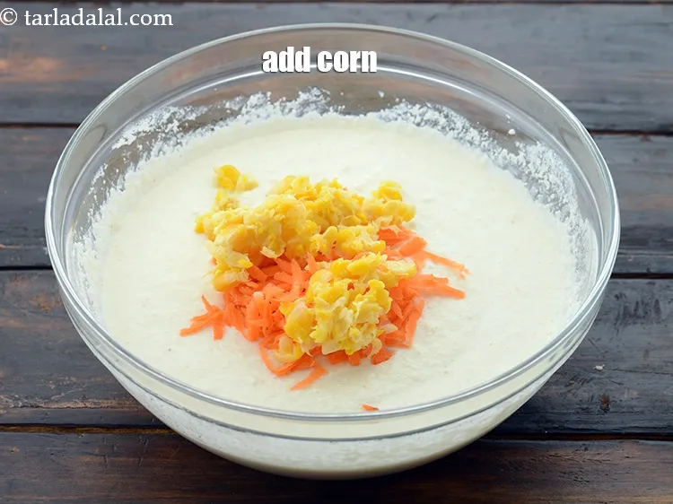 Step 13 – Add 2 tbsp&nbsp;boiled and coarsely&nbsp;<a href="https://www.tarladalal.com/glossary-crushed-sweet-corn-kernels-1605i">crushed sweet corn kernels (makai ke dane)</a>.