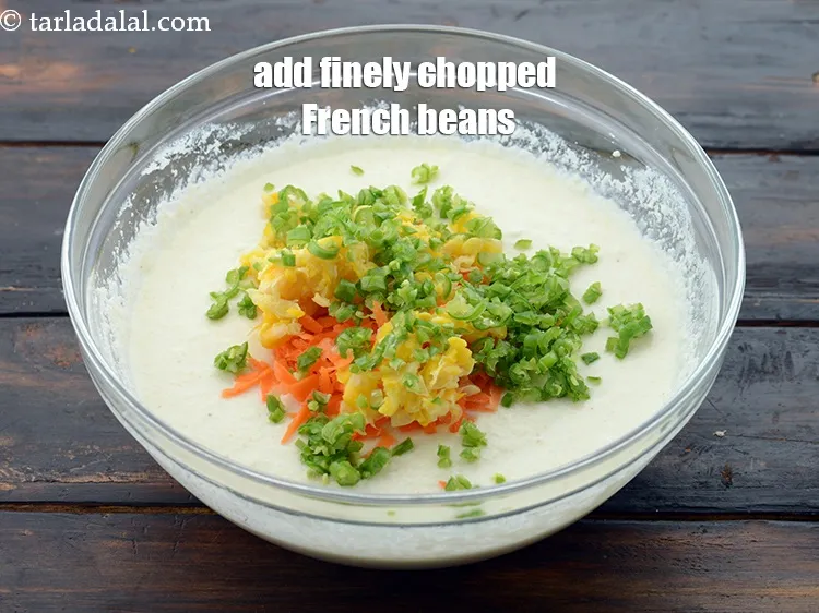 Step 14 – Add 2 tbsp&nbsp;finely&nbsp;<a href="https://www.tarladalal.com/glossary-chopped-french-beans-797i">chopped french beans</a>.&nbsp;