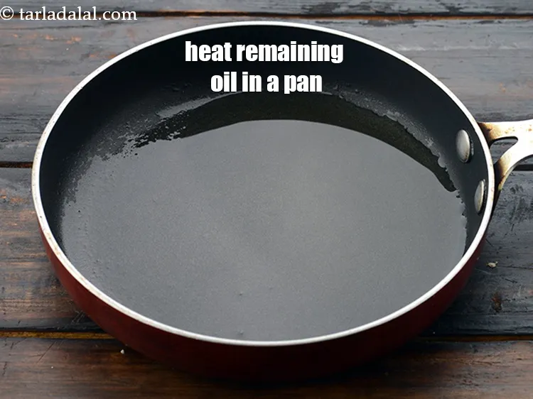 Step 17 – Heat the remaining &frac34; tbsp <a href="https://www.tarladalal.com/glossary-oil-671i">oil</a>&nbsp;in a small pan.