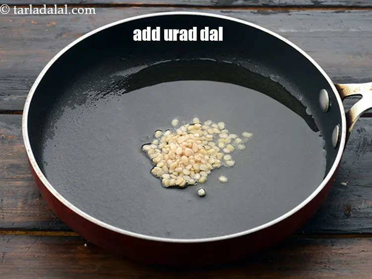 Step 18 – Add 1/2 tsp&nbsp;<a href="https://www.tarladalal.com/glossary-urad-dal-split-black-lentil-941i">urad dal (split black lentils)</a>.