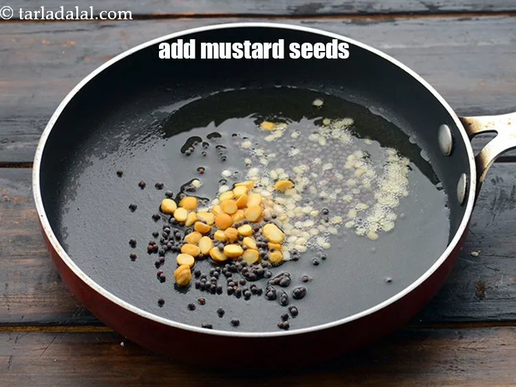 Step 20 – Add 1/2 tsp&nbsp;<a href="https://www.tarladalal.com/glossary-mustard-seeds-sarson-rai-sarson-ke-beej-525i">mustard seeds ( rai / sarson)</a>.