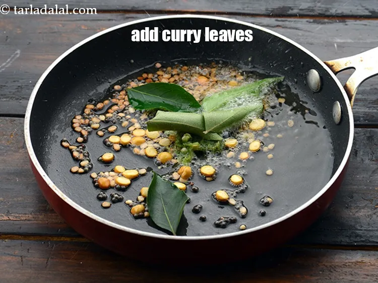 Step 22 – Add 7 to 8&nbsp;<a href="https://www.tarladalal.com/glossary-curry-leaves-kadi-patta-kadipatta-388i">curry leaves (kadi patta)</a>.