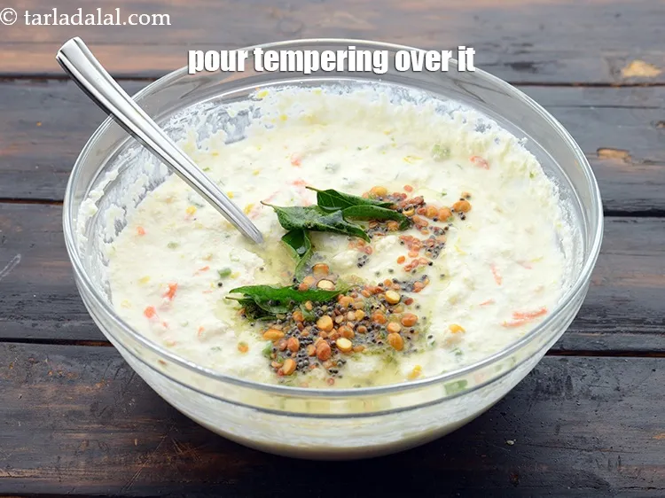 Step 24 – Pour the tempering over the semolina batter.