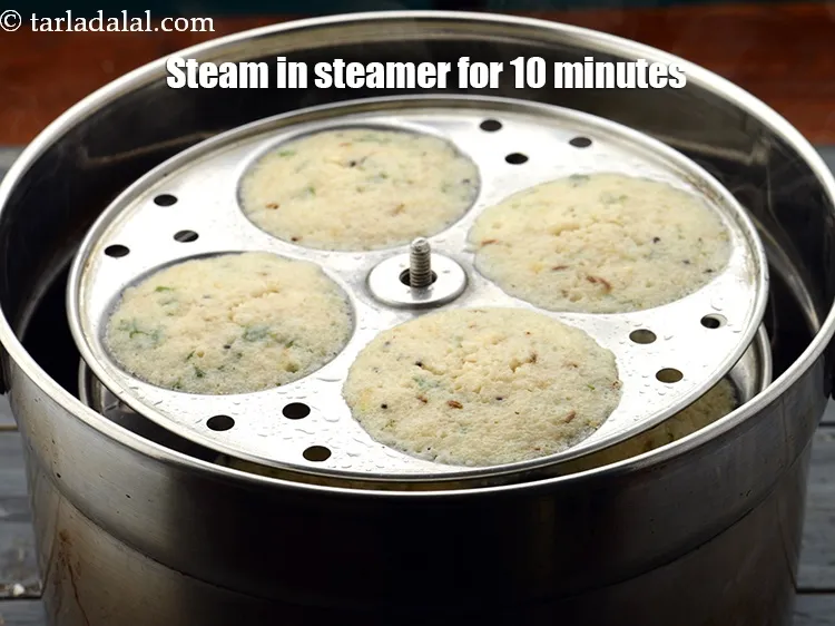 Step 33 – Steam in an idli steamer for 10 minutes or till they are cooked. If the …