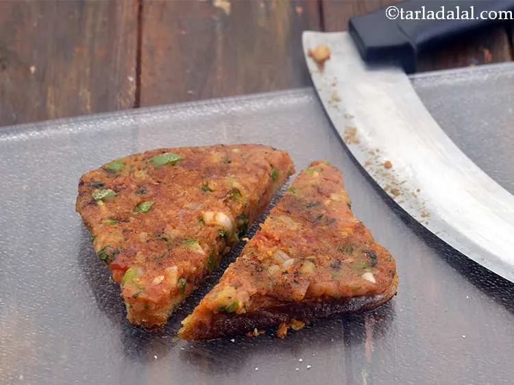 Step 17 – Cut the&nbsp;<strong>Pav Bhaji Masala Toast</strong>&nbsp;diagonally into 2 equal portions.