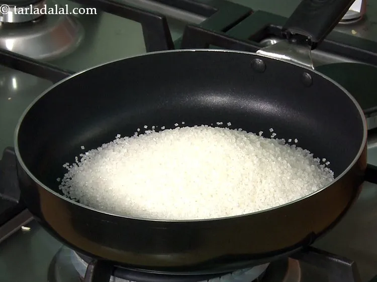 Step 8 – For the <strong>sugar syrup of jalebi,</strong> add the sugar is a broad non-stick pan. This …