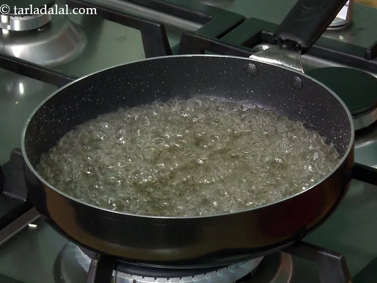 Step 11 – Cook on a high flame for 10 to 12 minutes or till the sugar syrup …