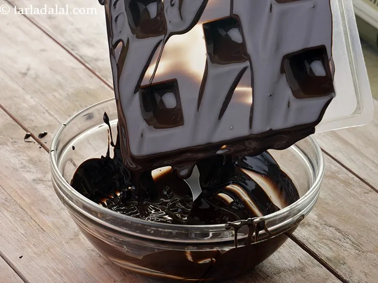 Step 27 – Overturn the mould and tap it lightly so that all the excess chocolate gets poured …