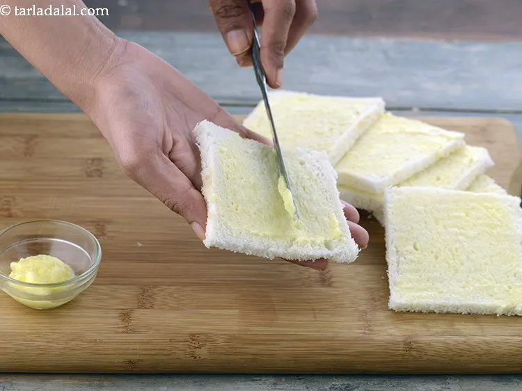 Step 12 – Apply &frac12; tsp of butter on each bread slice.