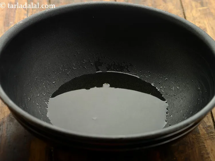 Step 3 – For making the <strong>jeera aloo bhaji</strong>, heat the oil in a deep non-stick kadhai. Make …