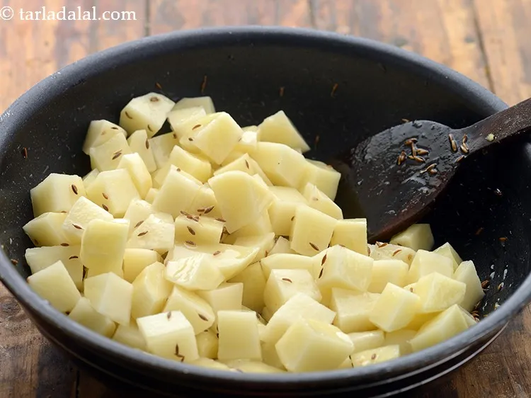 Step 6 – Mix well and cover with a lid to cook.