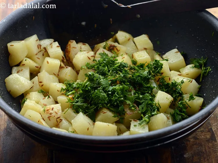 Step 11 – Add salt and add coriander to add freshness to the chatpata&nbsp;<strong>jeera aloo | Punjabi jeera …