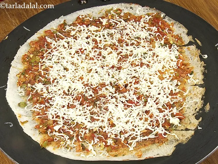 Step 26 – Sprinkle &frac14; cup of cheese and cook on a medium flame for 1 minute. You …