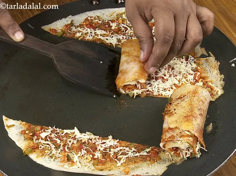 Step 27 – Roll each portion tightly and our street-style jini dosa is ready.