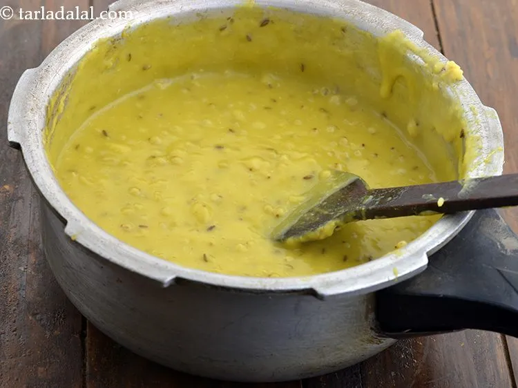 Step 18 – Mix well and cook <strong>sorghum khichdi</strong> on a medium flame for 2 to 3 minutes, …