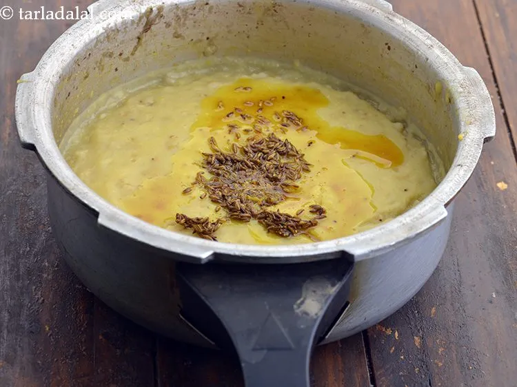 Step 17 – Add the tempering to the <strong>jowar khichdi for diabetes</strong>.&nbsp;