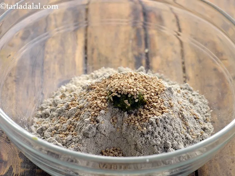 Step 6 – Add sesame seeds. Sesame seeds will give a slight nutty taste to the<strong> Jowar Bajra …