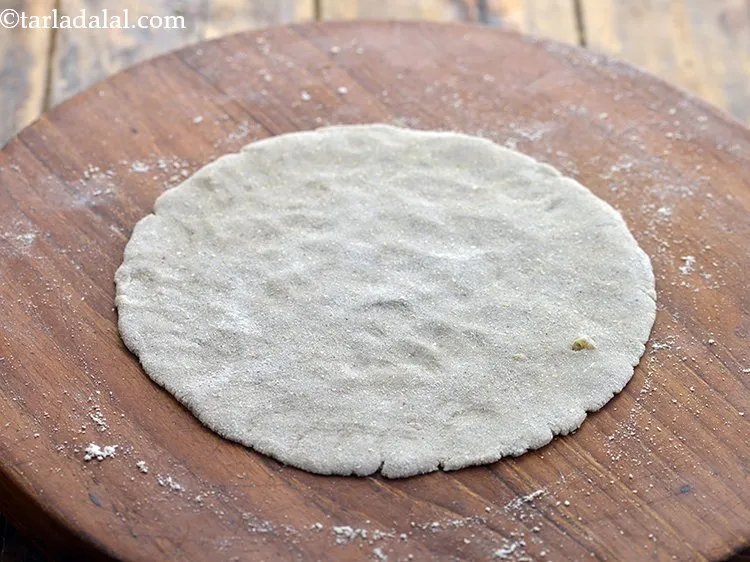 Step 10 – Roll out a portion into a circle of 150 mm. (6&quot;) diameter using a little …