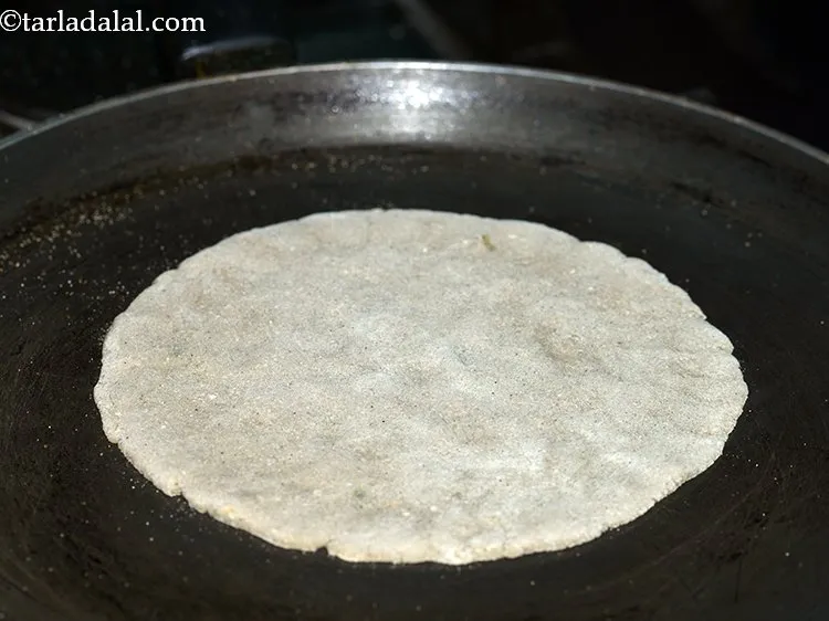 Step 11 – Heat a non-stick tava (griddle), place the roti over it and cook it for a …