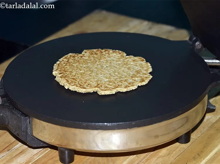 Step 38 – Keep flipping the <strong>Jowar Khakhra with Til</strong> every 20 seconds. Repeat this procedure till the …