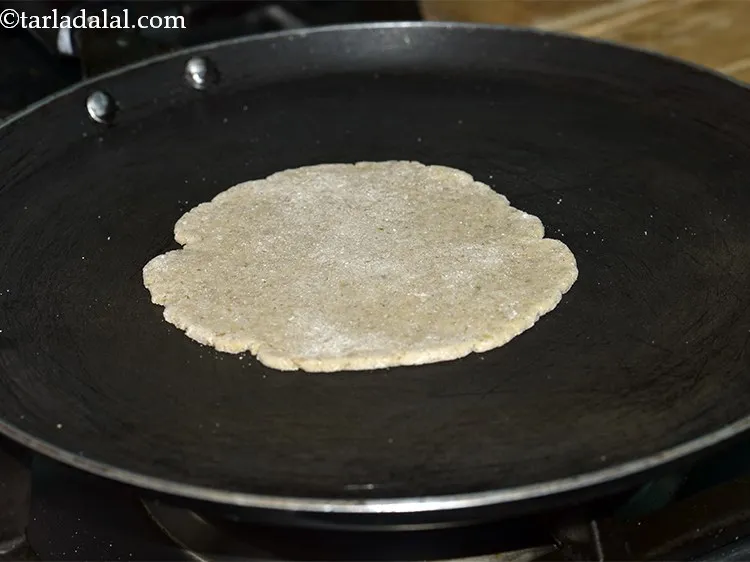 Step 17 – Place it on the hot non-stick tava and allow it to cook on a medium …