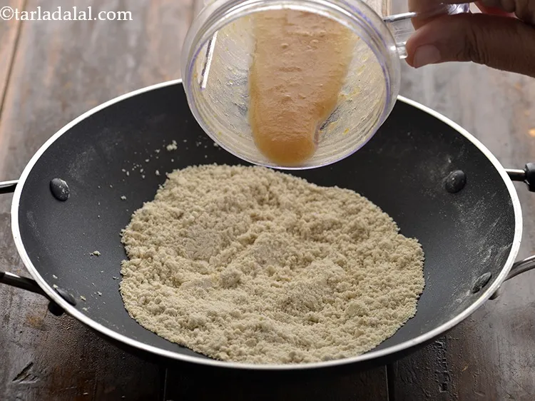 Step 13 – As the colour of the jowar flour changes to light brown, add the prepared dates …