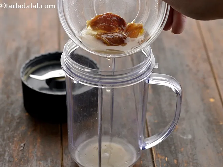 Step 8 – After soaking, transfer the dates along with water in a mixer jar.