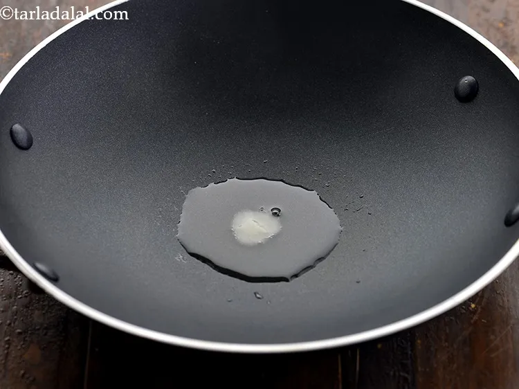 Step 10 – Now, take a small non-stick pan.&nbsp;Add ghee to it, switch on the flame and allow …