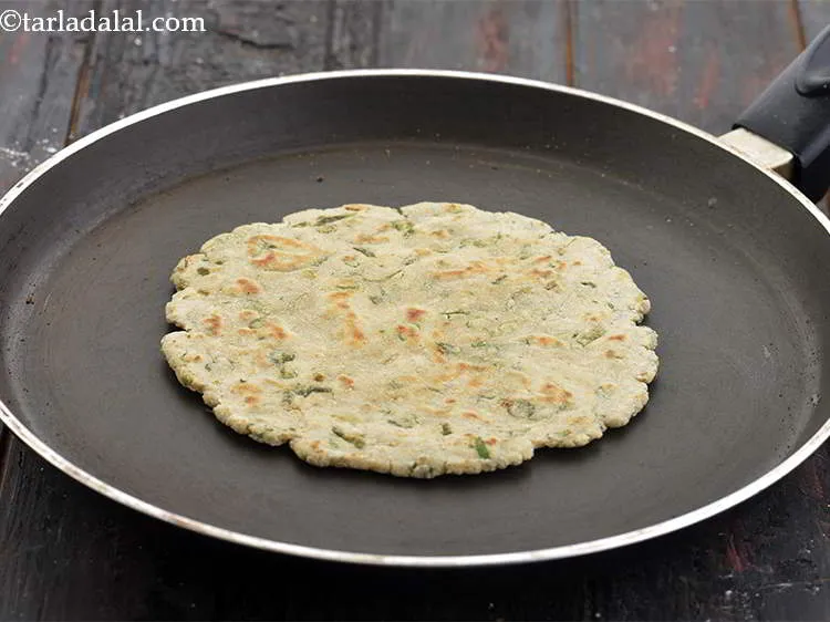Step 19 – Cook till the brown spots appear on both the sides of the roti.