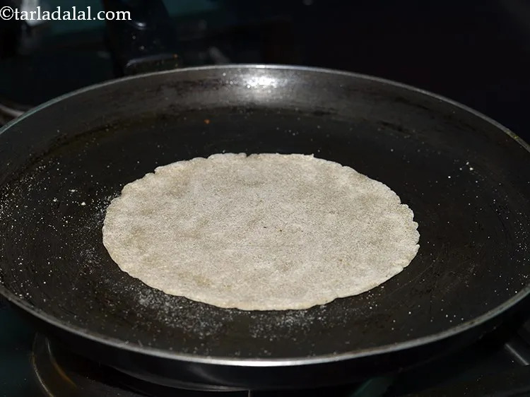 Step 17 – Turn over the roti and cook for 1 minute.