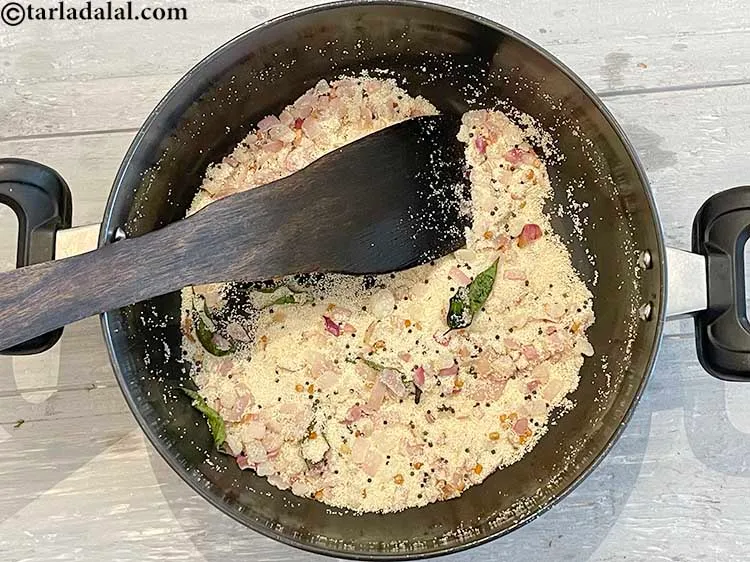 Step 10 – <meta charset="UTF-8" /> Saut&eacute; rava on a medium flame for another 2 minutes while stirring&nbsp;<meta …