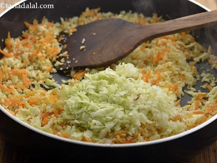 Step 18 – Add grated cabbage to it.
