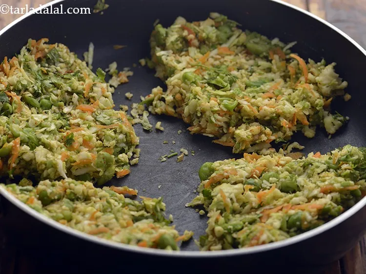 Step 24 – Keep stirring occasionally so the Veggie Stuffing for Jowar Veggie Wrap doesn&rsquo;t burn and stick …