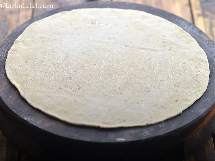 Step 9 – Roll out a portion of the dough into a 175 mm (7&rdquo;) diameter circle using …