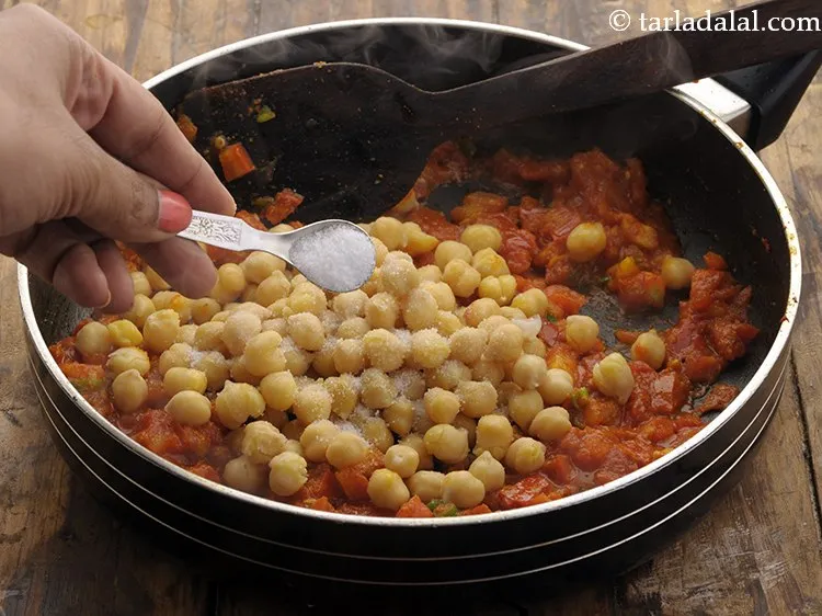 Step 23 – Add the cooked kabuli chana and salt.