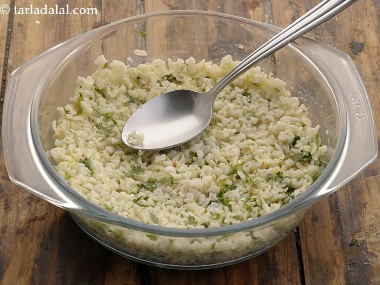 Step 32 – Take a baking dish, put half of the rice mixture in the dish and spread …