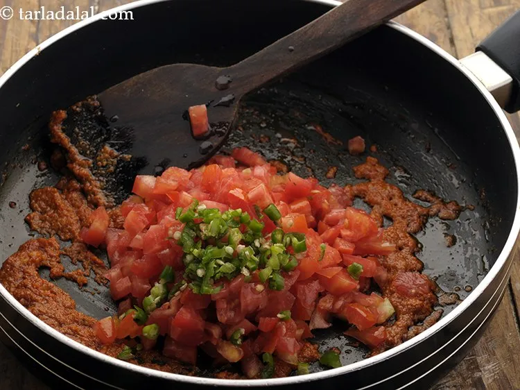 Step 21 – Add green chillies, you can adjust the spice accoding to your preference.&nbsp;