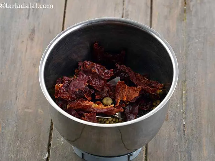 Step 3 – Remove the stalk and add the whole red chillies. It is advisable to break whole …