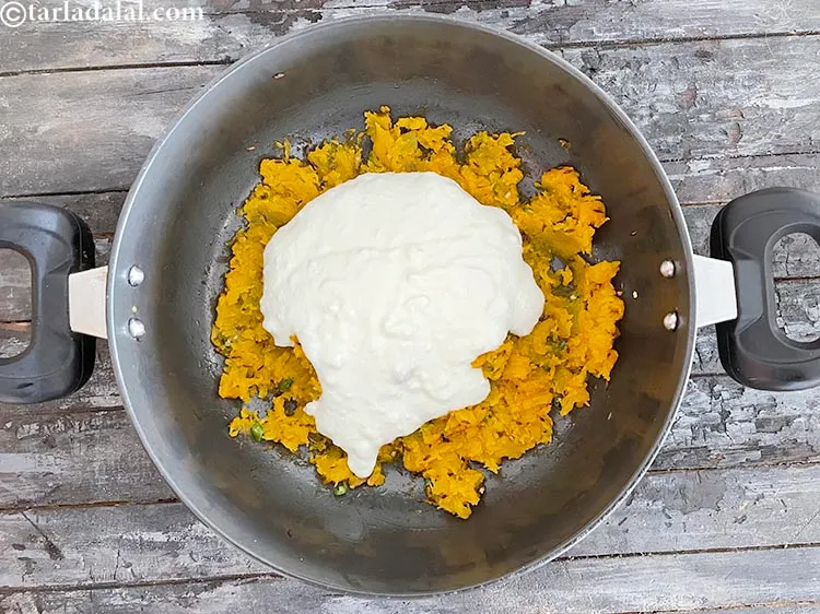 Step 17 – Add&nbsp;<meta charset="UTF-8" />1 1/2 cups&nbsp;<a href="glossary-whisked-curds--2096i">whisked curds (dahi)</a>.