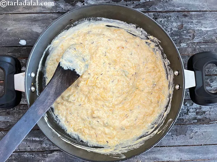 Step 24 – Mix the mashed pumpkin, curd and milk well to get a uniform raita.&nbsp;
