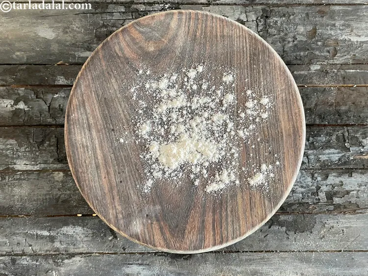 Step 20 – Dust some whole wheat flour on a rolling board.