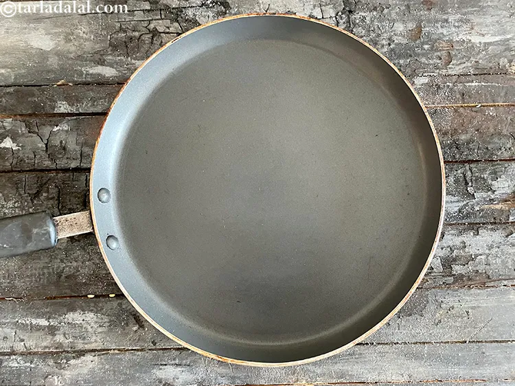 Step 23 – <meta charset="UTF-8" /> Heat a non-stick tava (griddle). Don't add oil at this stage.