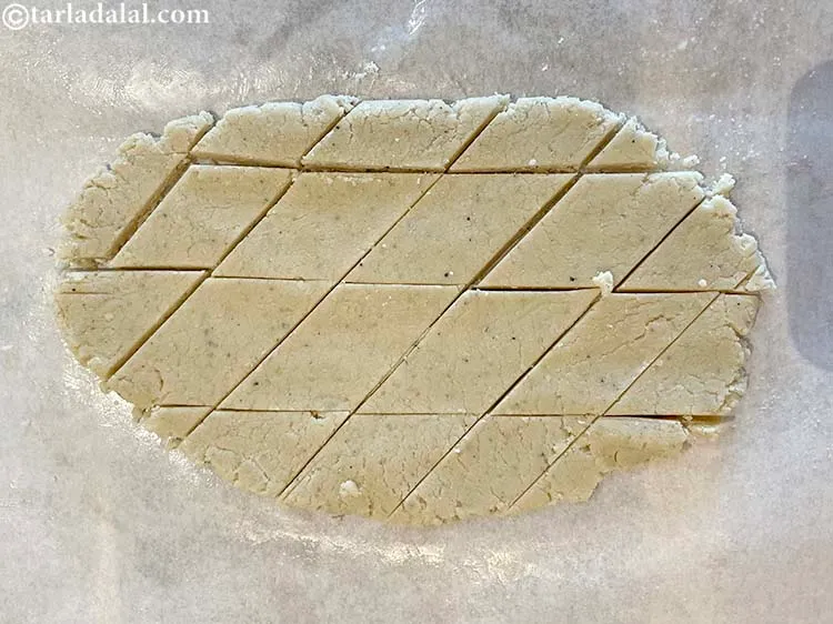 Step 19 – Allow the mixture to cool a bit and then cut them into diamond shape. Let …