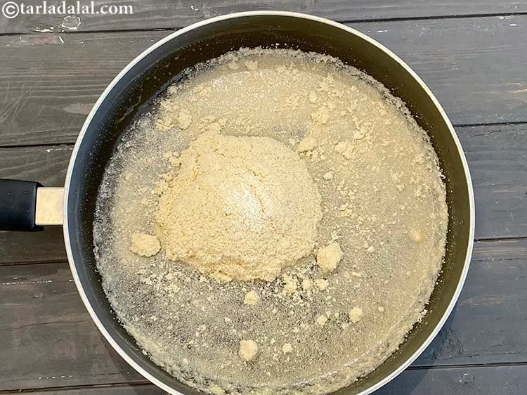 Step 10 – Add the cashew powder in 2 batches so that they will cook without forming lumps.&nbsp;
