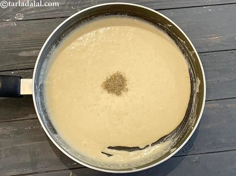 Step 13 – Add 1 1/2 teaspoons ghee and cardamom powder.