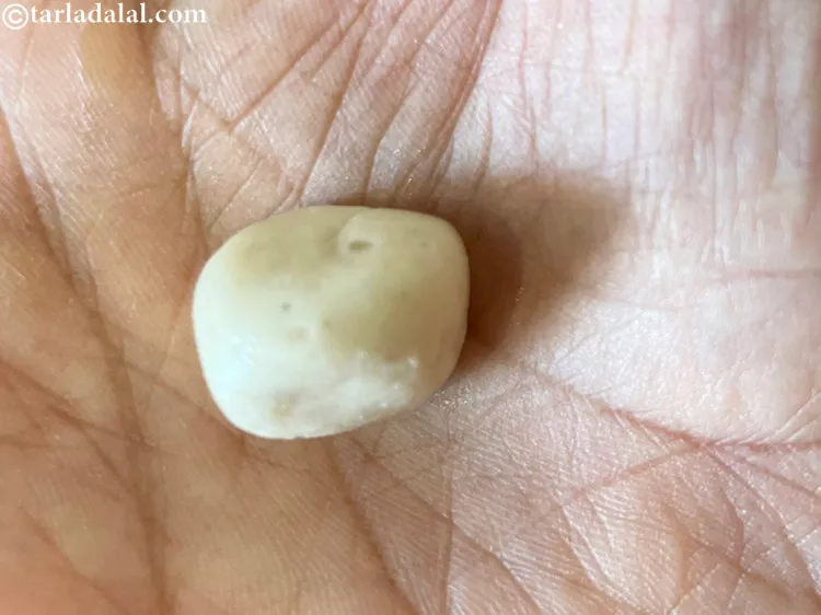 Step 15 – <meta charset="UTF-8" /> See if the mixture is ready to make katli. Take the pan …