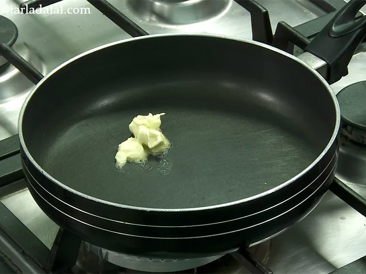 Step 15 – To cook <strong>Kaju Puri&nbsp;</strong>mixture, now heat 3 tsp of unsalted butter in a broad non-stick …