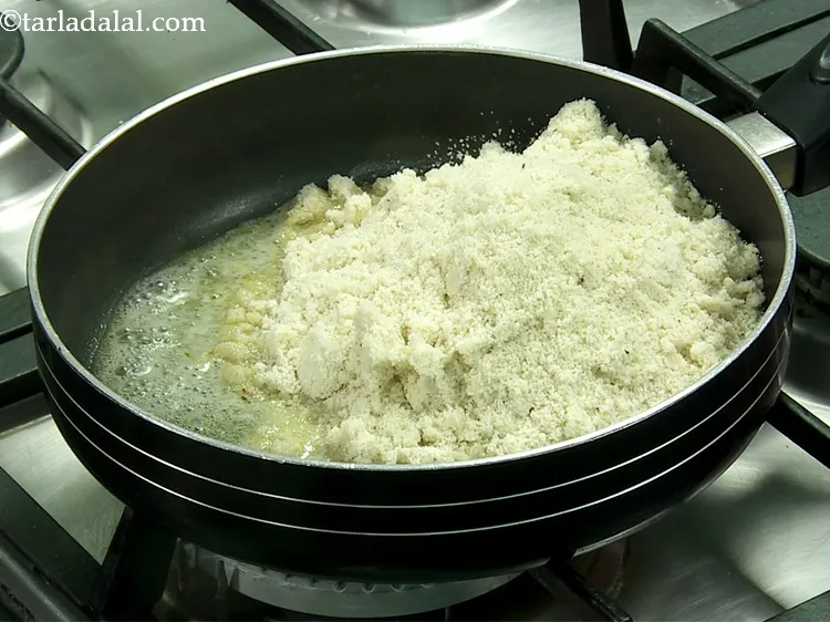 Step 18 – Add the cashew-almond-sugar mixture to it.&nbsp;