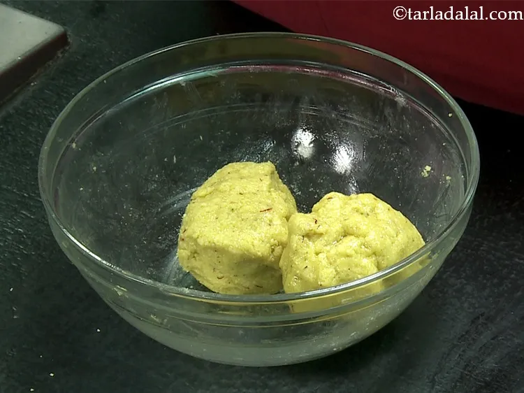 Step 26 – Divide the dough of <strong>Cashewnut Puri </strong>into 2 equal portions.&nbsp;